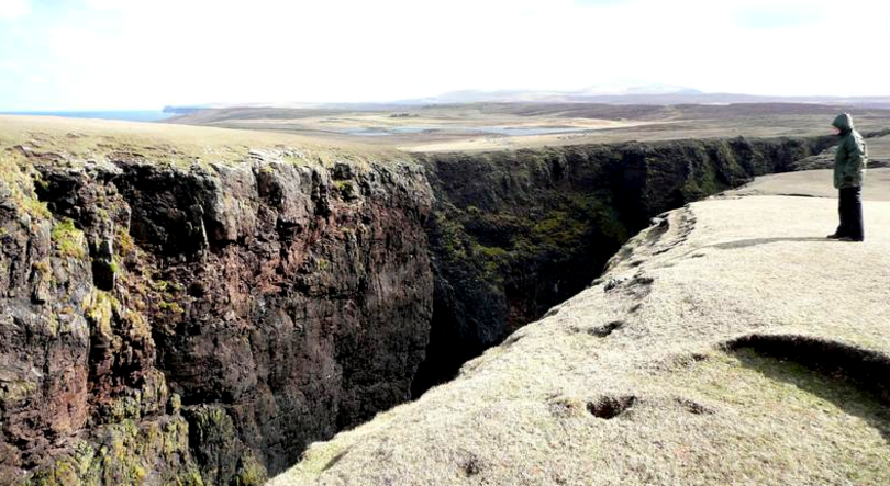 Crevasse caused by coastal erosion, probably the reason that Shetland is made of so many small islands.